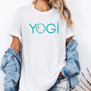 Female yogi with long hair wearing a white yoga t-shirt with a graphic of Washington State and the word yogi.
